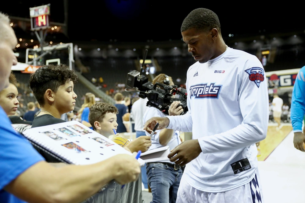 Joe Johnson of the Triplets greets fans during week one of the BIG3