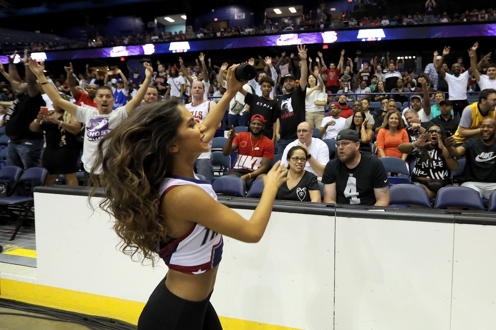 Dancers throw t-shirts to fans during week seven of the BIG3